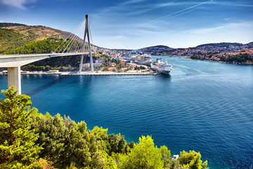 Franjo Tudjman bridge and blue lagoon with harbor of Dubrovnik,D - Powered by Adobe