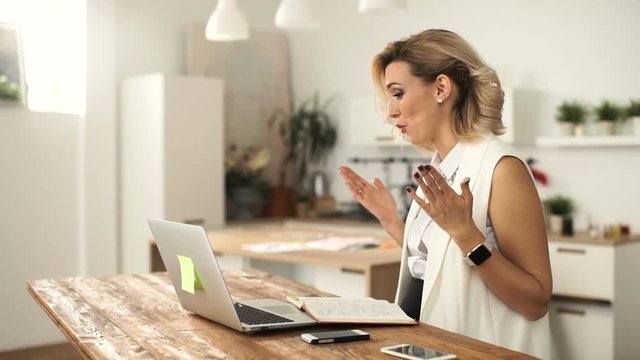 Happy attractive young woman having a video chat