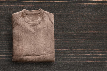 Pullover on wooden background