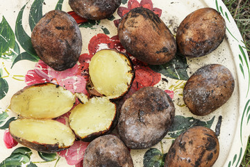 Baked potatoes on a tray.