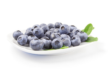 Close-up of fresh blueberries in white bowl on  background
