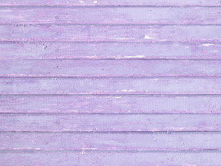 Vintage wood wall background with violet peeling paint