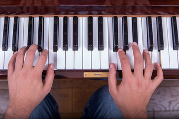 Man playing piano with both hands closeup2