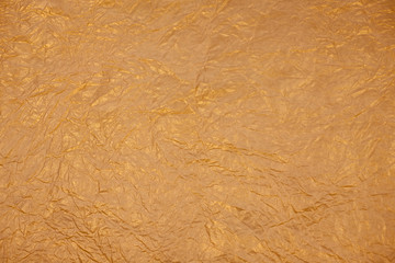 Christmas golden background. Golden paper texture. Place for text