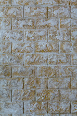The wall of the house of white and brown stone
