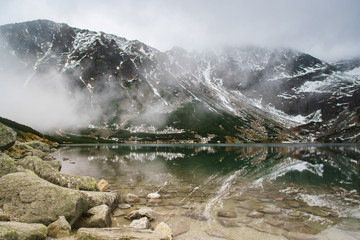 black lake in Tatry mountains, Poland - a remarkable reflection in water