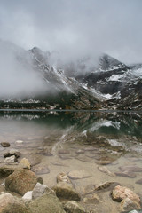 black lake in Tatry mountains, Poland - a remarkable reflection in water