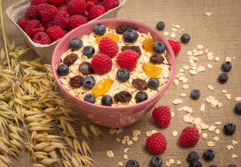Healthy porridge with fruits on canvas