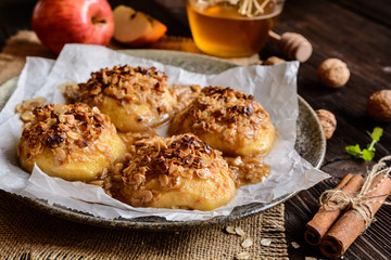 Baked apple with oatmeal, walnuts, honey and cinnamon
