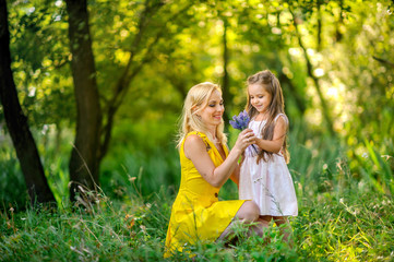 girl together with mother play in the park