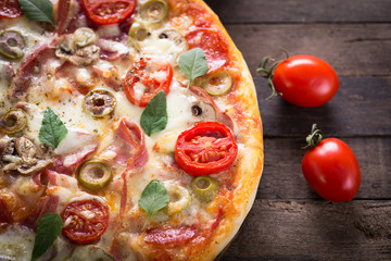 Homemade pizza on the wooden table 
