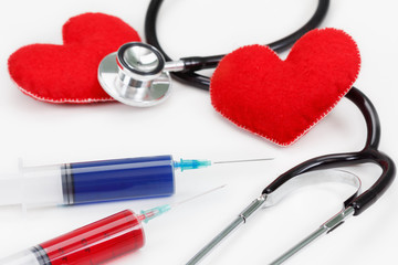 Stethoscope, syringe and heart. Health concept.