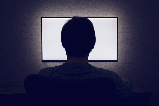 Man in front of a blank monitor