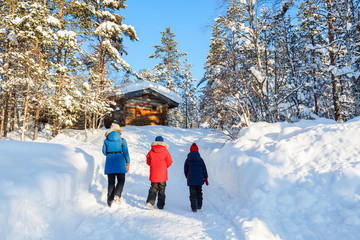 Mother and kids outdoors on winter