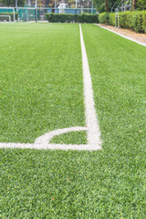 Corner of the soccer ( football ) field.artificial grass