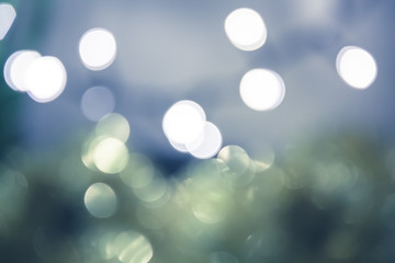 Blue green bokeh lights as winter background in vintage style