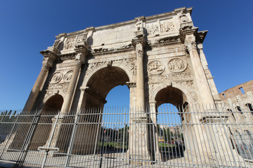 Fototapeta na wymiar The Arch of Constantine (Arco Constantino), a ruin of the ancient Roman empire stands alongside the Colosseum in Rome, Italy.