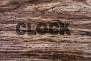 word clock on wooden background