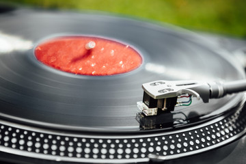 turntable with LP vinyl record, closeup view
