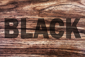 Fototapeta premium word black on wooden background