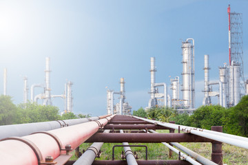 Industrial equipment and pipelines at the gas processing plant on a bright sunny summer day