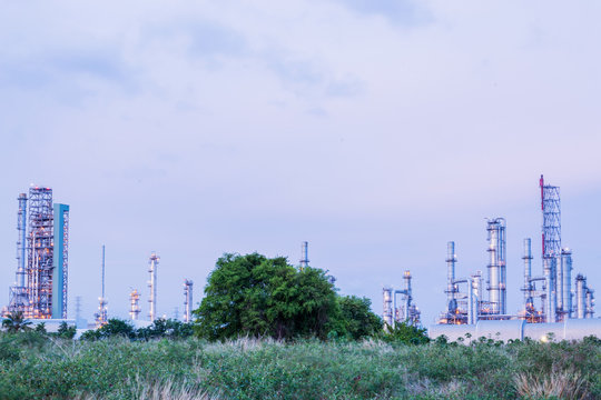 Oil refinery along daytime with blue sky