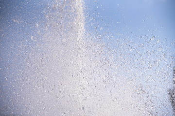 The gush of water of a fountain. Splash of water in the fountain