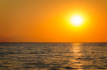 Fototapeta premium Beautiful orange sunset over the sea
