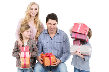 Happy family with gifts isolated on white.