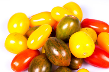 colored tomatoes on a pure white background