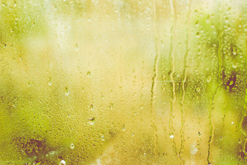 Rainy day. Water drops on window glass.