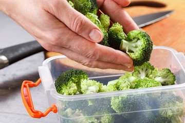 Trays with raw broccoli for freezing.