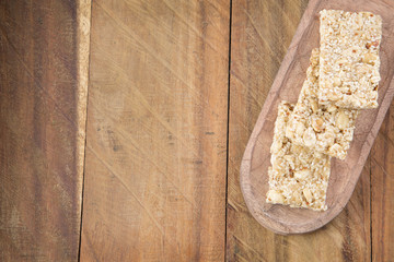 Amaranth bars in the wooden background