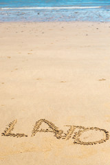'Lato' word written on sand