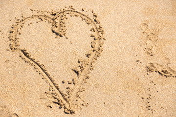 Heart drawn on sand