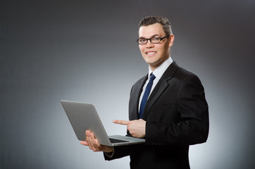 Man with laptop in business concept