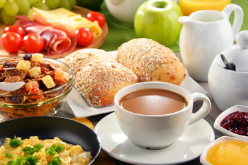 Breakfast served with coffee, juice, egg, and rolls