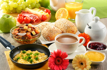 Breakfast served with coffee, juice, egg, and rolls