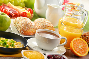 Breakfast served with coffee, juice, egg, and rolls