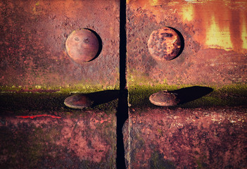 detail of an old iron fencing riveted joints