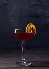 Alcohol cocktail drink on the rustic background