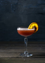 Alcohol cocktail drink on the rustic background