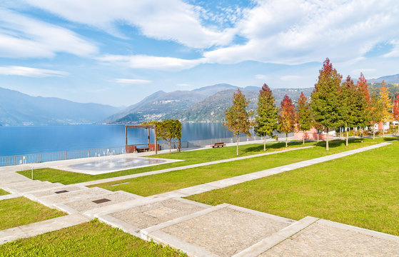 Autumn park with colorful trees on the lakefront of Luino, Varese, Italy
