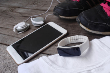 Sport set of shoes with smart phone and earphones