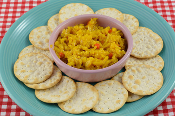 Appetizer plate of table water crackers and cole slaw salsa