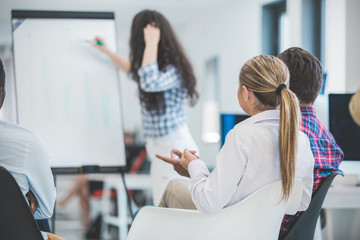 Businessman giving a presentation to his colleagues at work