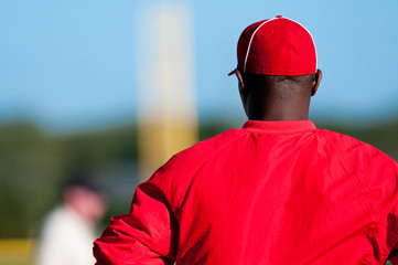 African american baseball coach from behind