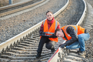 Fototapeta na wymiar Railroad workers maintaing railways