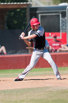 High school baseball player batting