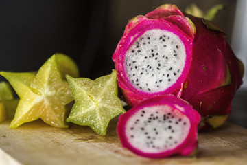 Freshly cut dragon fruit on a wooden cutting board